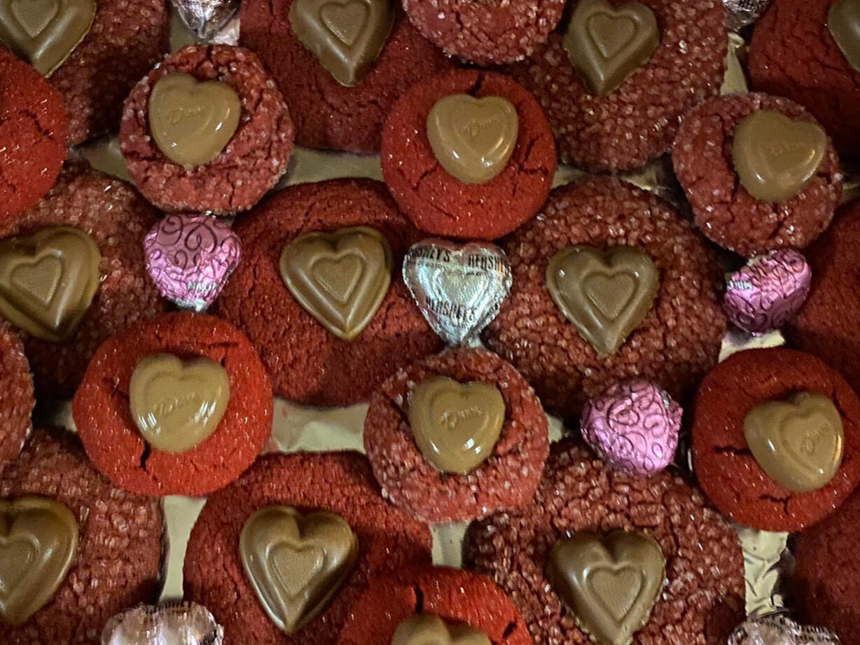 Pictured are our classic Valentine's Day Rich Red Velvet cookies. With chocolate heart cookies melted into the top, they're sure to melt your heart, too!